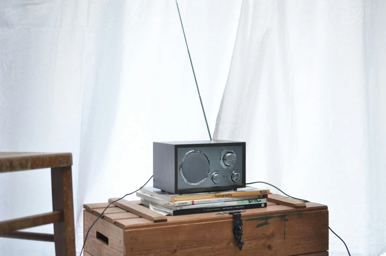 a television sitting on top of a wooden box, radio, grey, hero shot, portrait n - 9