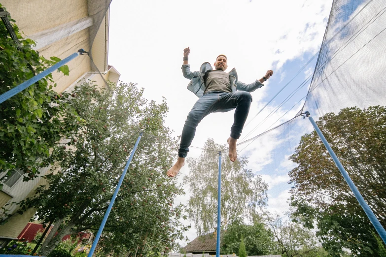 a person jumping in the air on a trampol, happening, adventure playground, wētā fx, at home, tarmo juhola