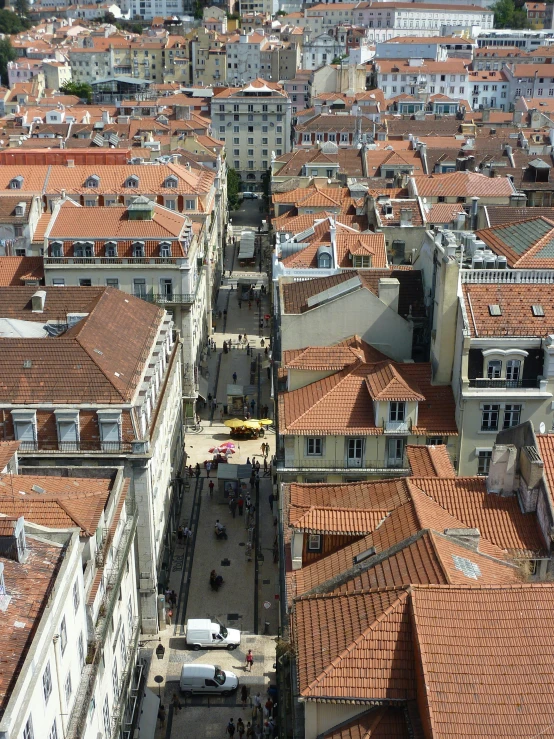 a view of a city from the top of a building, baroque winding cobbled streets, slide show, lisbon, profile image