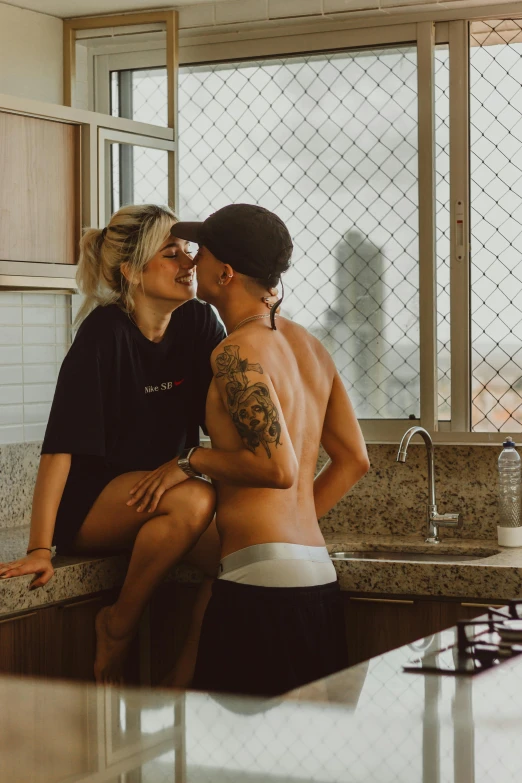 a man and a woman kissing in a kitchen, a tattoo, by Elsa Bleda, pexels contest winner, bra and shorts streetwear, brazil, overlooking, boys