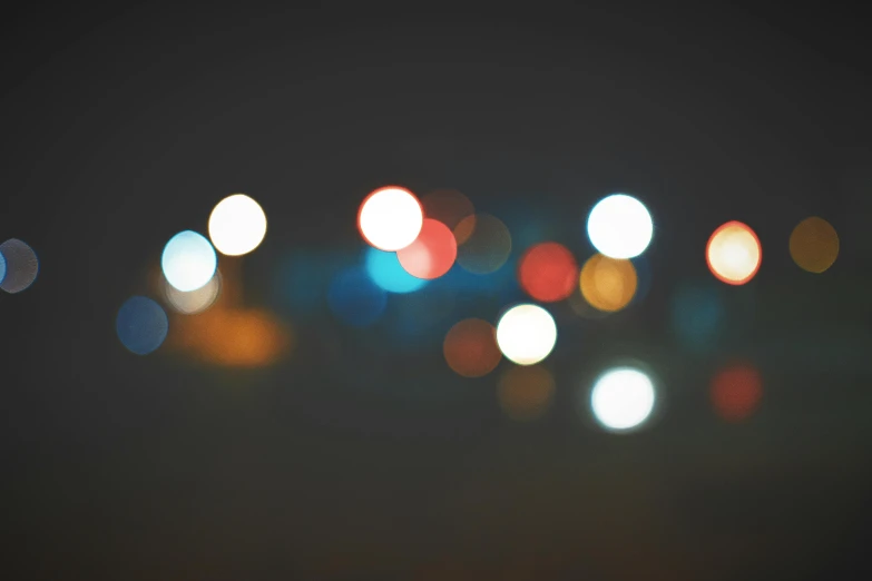 a blurry photo of a city at night, pexels, minimalism, macro bokeh ”, a colorful, overcast bokeh - c 5, paul barson