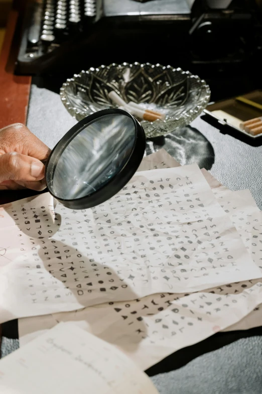 a person looking through a magnifying glass, a silk screen, kanji insignia and numbering, ingredients on the table, zoomed in, transparent