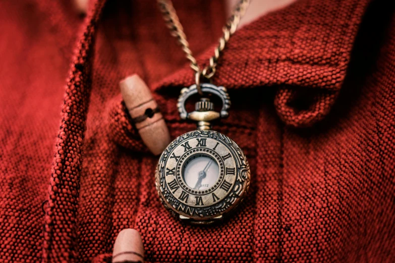 a close up of a person wearing a pocket watch, by Julia Pishtar, pexels contest winner, renaissance, mini model, wooden jewerly, close up shot of an amulet, clothing photography