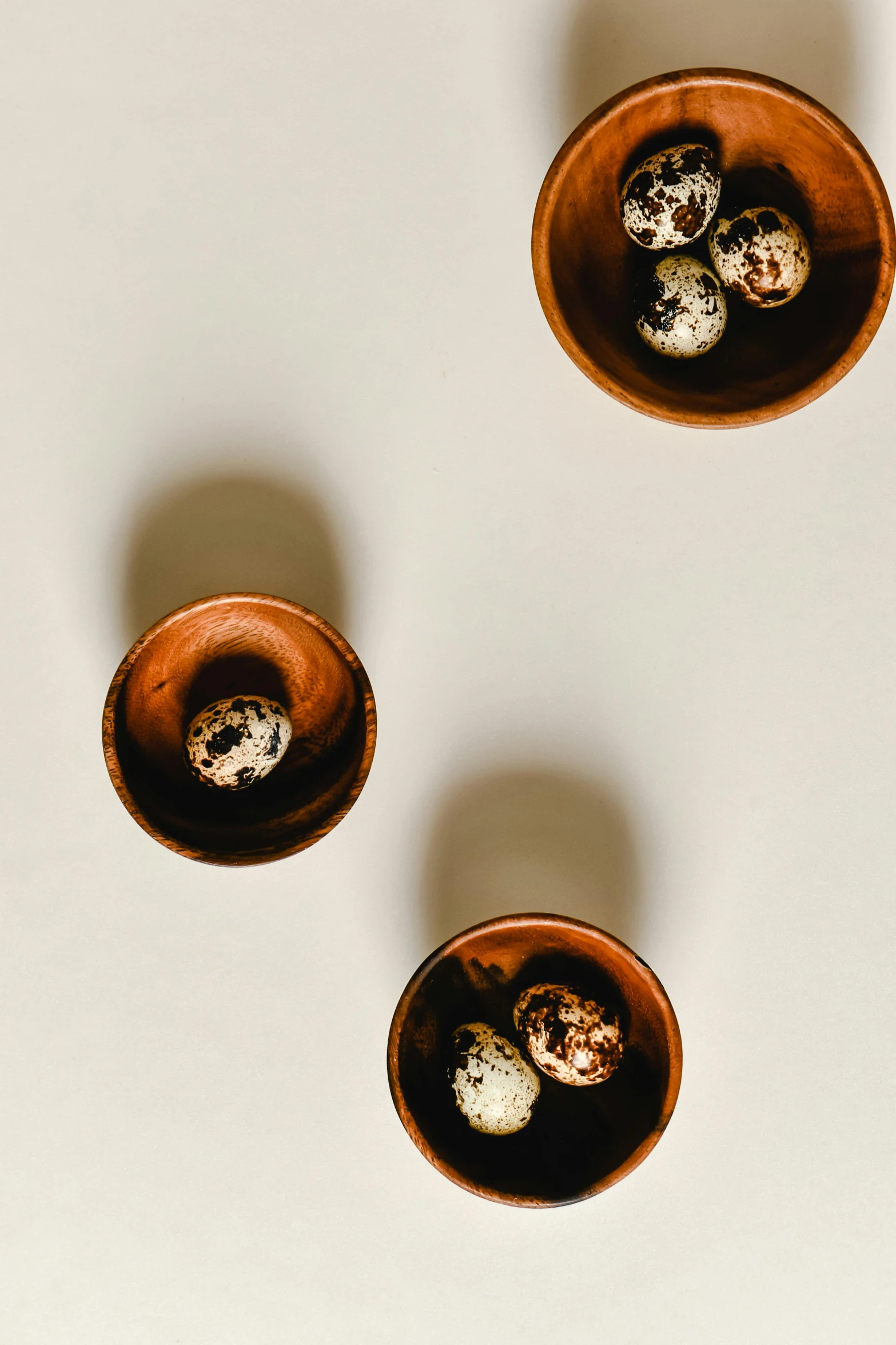 a group of bowls sitting on top of a table, trending on unsplash, visual art, eggs, brown:-2, thumbnail, made of glazed