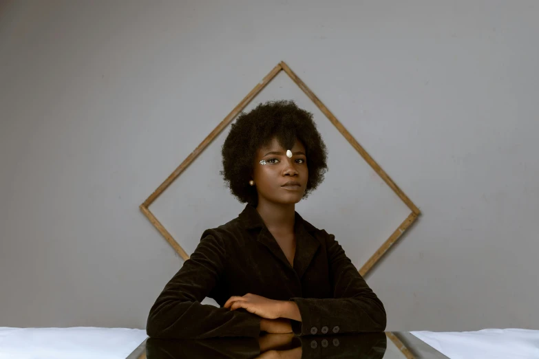 a woman sitting at a table in front of a mirror, an album cover, pexels contest winner, afrofuturism, square, portrait 8 k, girl in a suit, slight overcast lighting