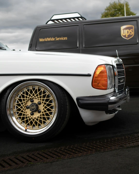 a white mercedes benz benz benz benz benz benz benz benz benz benz benz benz benz benz benz, an album cover, by Jesse Richards, unsplash contest winner, hyperrealism, black and gold wires, high detailed deep dish wheels, golden rainbow tubing, from the 7 0 s