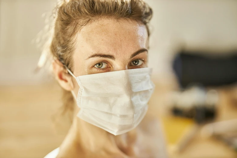 a close up of a person wearing a face mask, by Nina Hamnett, medical, genevieve o'reilly, 30 years old woman, indoor picture