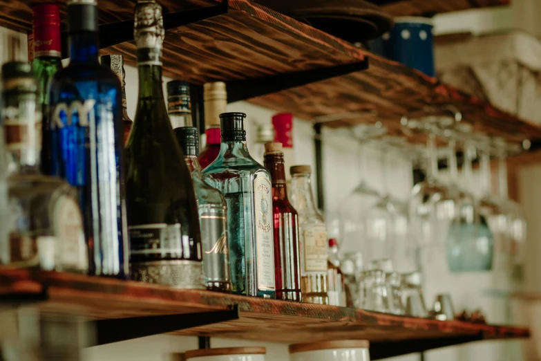 a bunch of bottles and glasses on a shelf, pexels, local bar, profile image, thumbnail