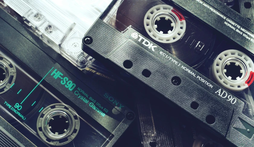 a couple of cassettes sitting next to each other, unsplash, old tape, high samples, technologies, large format