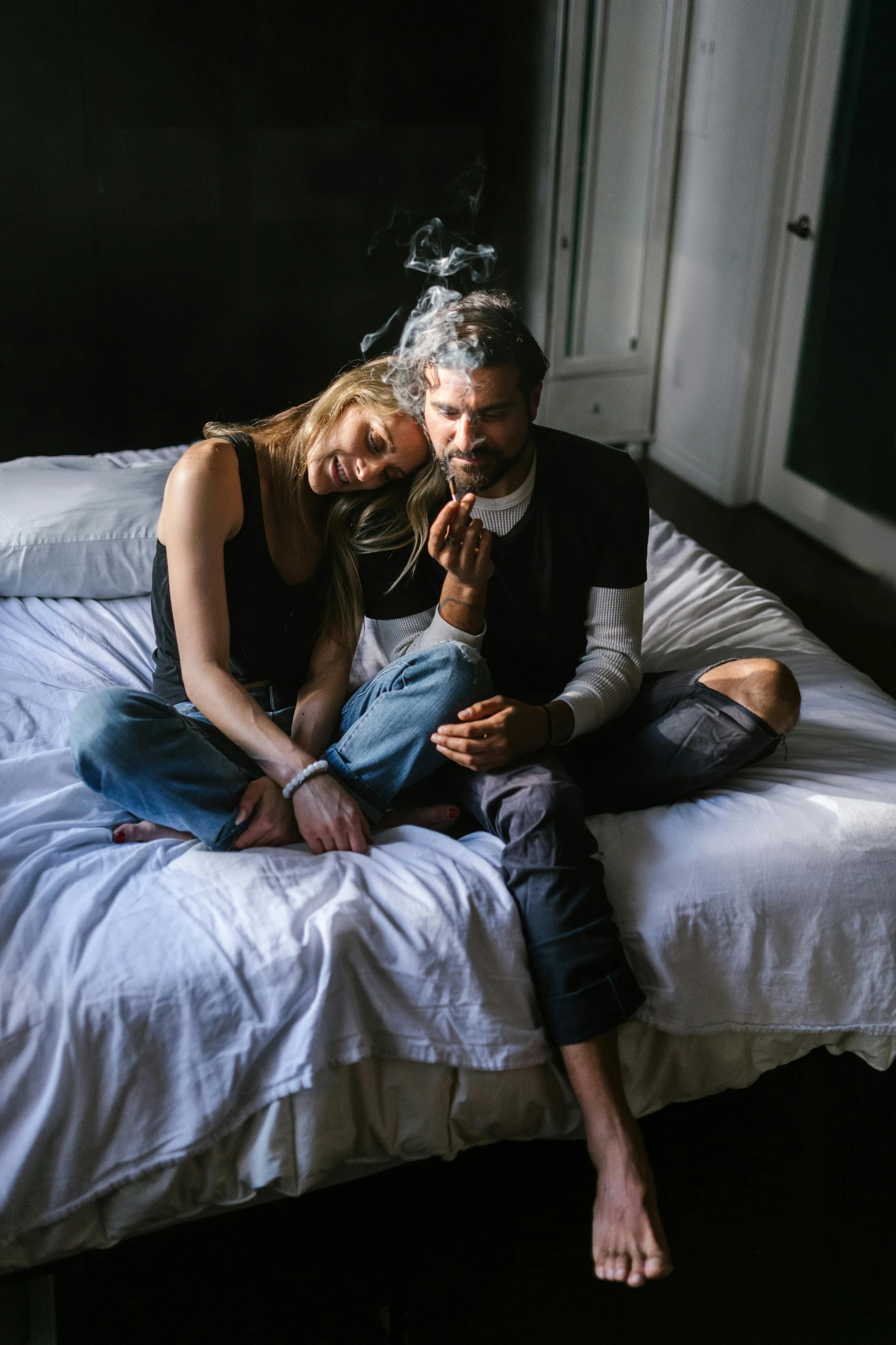 a man and a woman sitting on a bed, by Elsa Bleda, pexels, scruffy man, black chalk, with a long, drunk