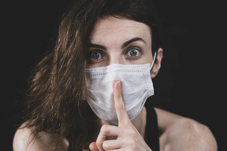 a close up of a person wearing a face mask, trending on pexels, antipodeans, giving the middle finger, nurse, mysterious woman, made of lab tissue