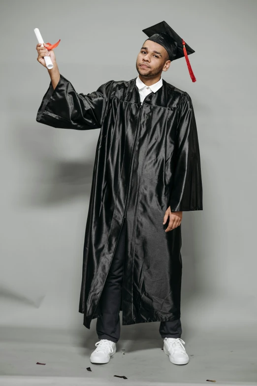 a man in a graduation gown holding a diploma, reddit, academic art, black leather garment, wide full body, 2019 trending photo, 2000s