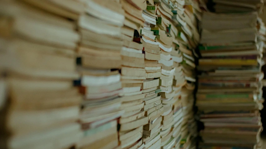 a bunch of books stacked on top of each other, trending on unsplash, background image, cinematic close shot, classified government archive, liminal bookshop