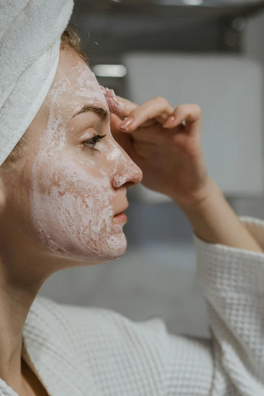 a woman with a towel wrapped around her head, trending on pexels, renaissance, a plaster on her cheek, frosting on head and shoulders, wearing mask, heart shaped face