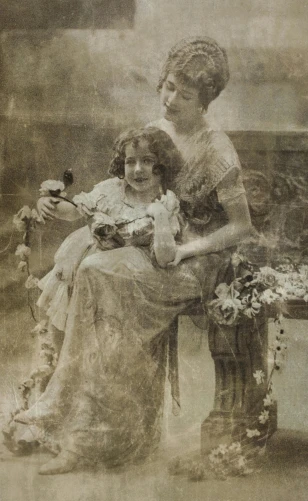 an old photo of two women sitting on a bench, art nouveau, holding flowers, promotional image, newspaper photograph, ( ( photograph ) )