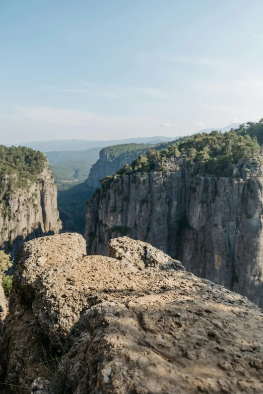 a man standing on top of a cliff, les nabis, gigapixel photo, spain, 8 k wide shot, alabama