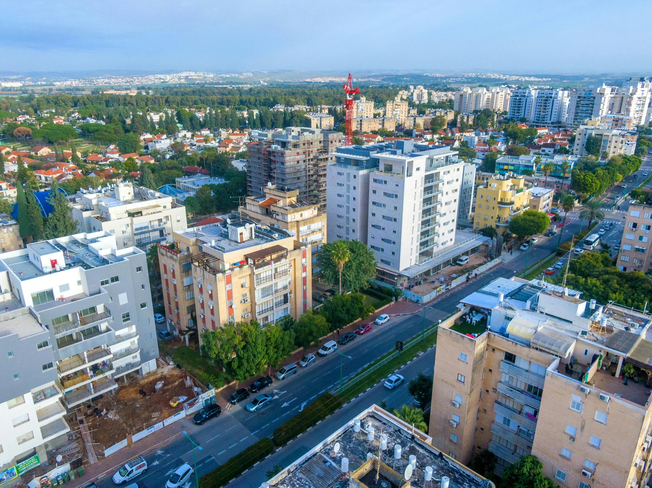 an aerial view of a city with lots of tall buildings, by Steven Belledin, unsplash, bauhaus, israel, 8k high quality and resolution, ultrawide image, an extremely high quality hd