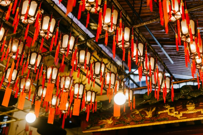 a bunch of red and white lanterns hanging from the ceiling, by Julia Pishtar, trending on unsplash, chinatown bar, 🦩🪐🐞👩🏻🦳, with an intricate, an ancient