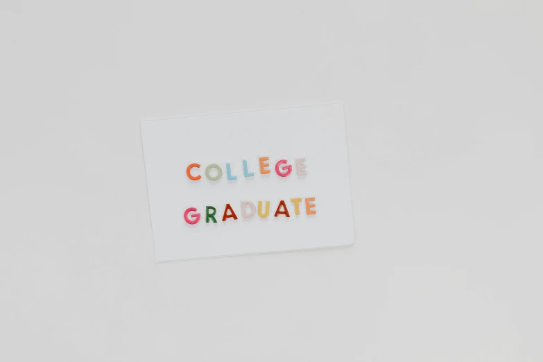 a piece of paper with the words college graduate written on it, by Nicolette Macnamara, unsplash, academic art, set against a white background, multicolored, minimalist sticker, college party