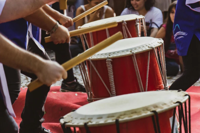 a group of people that are playing drums, pexels contest winner, tamborine, mikado, braziers, profile image