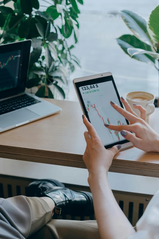 a woman sitting at a desk using a tablet computer, trending on pexels, trading stocks, corporate phone app icon, square, earthy