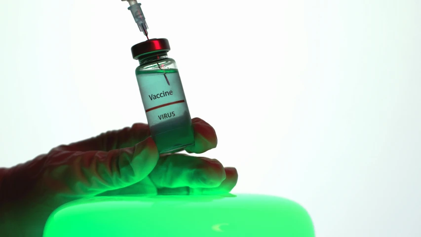 a person holding a vial with a needle sticking out of it, shutterstock, holography, green bright red, round bottle, uv,