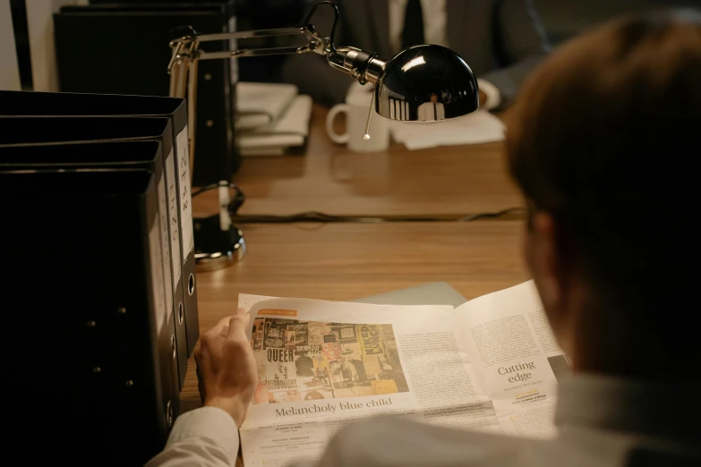 a man sitting at a desk reading a newspaper, by Mathias Kollros, trending on reddit, private press, cinematic still of westworld, high quality photo, detailed color scan”, thumbnail