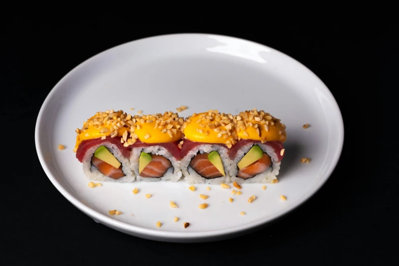 a close up of a plate of food on a table, sushi, seen from the side