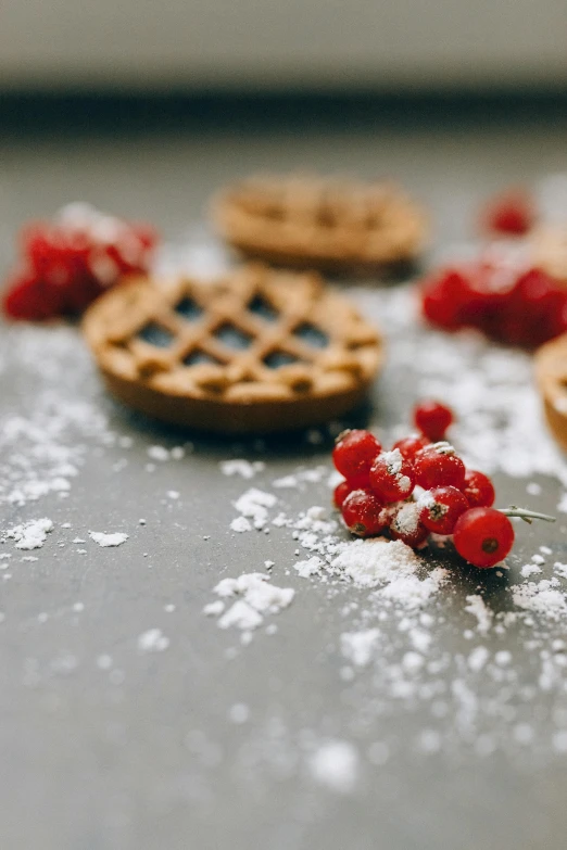 a table topped with cookies and berries covered in powdered sugar, pexels contest winner, mini model, grey, thumbnail, 33mm photo