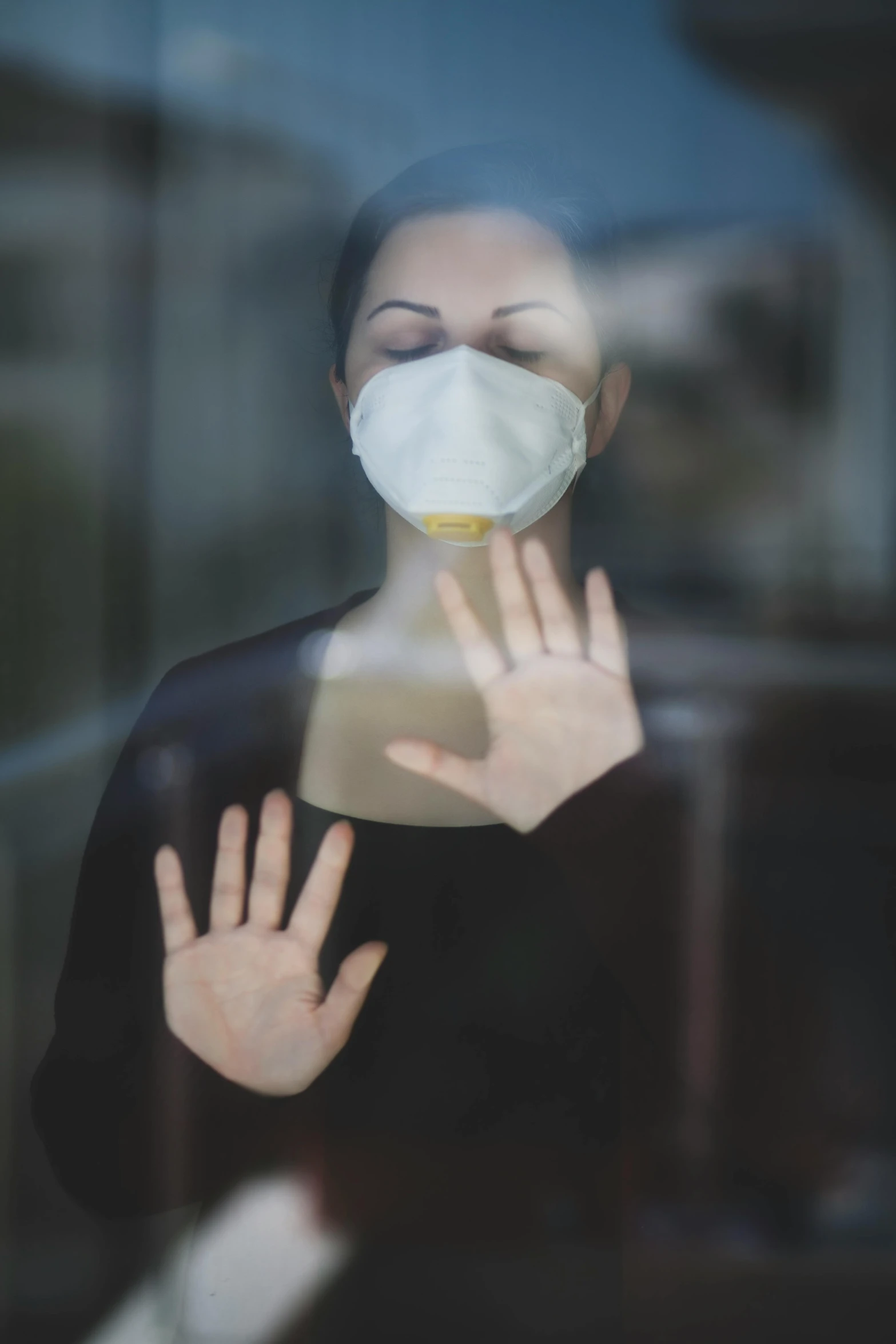 a woman wearing a face mask in front of a window, happening, hand instead of a face, contaminated, 2 0 1 0 s, square