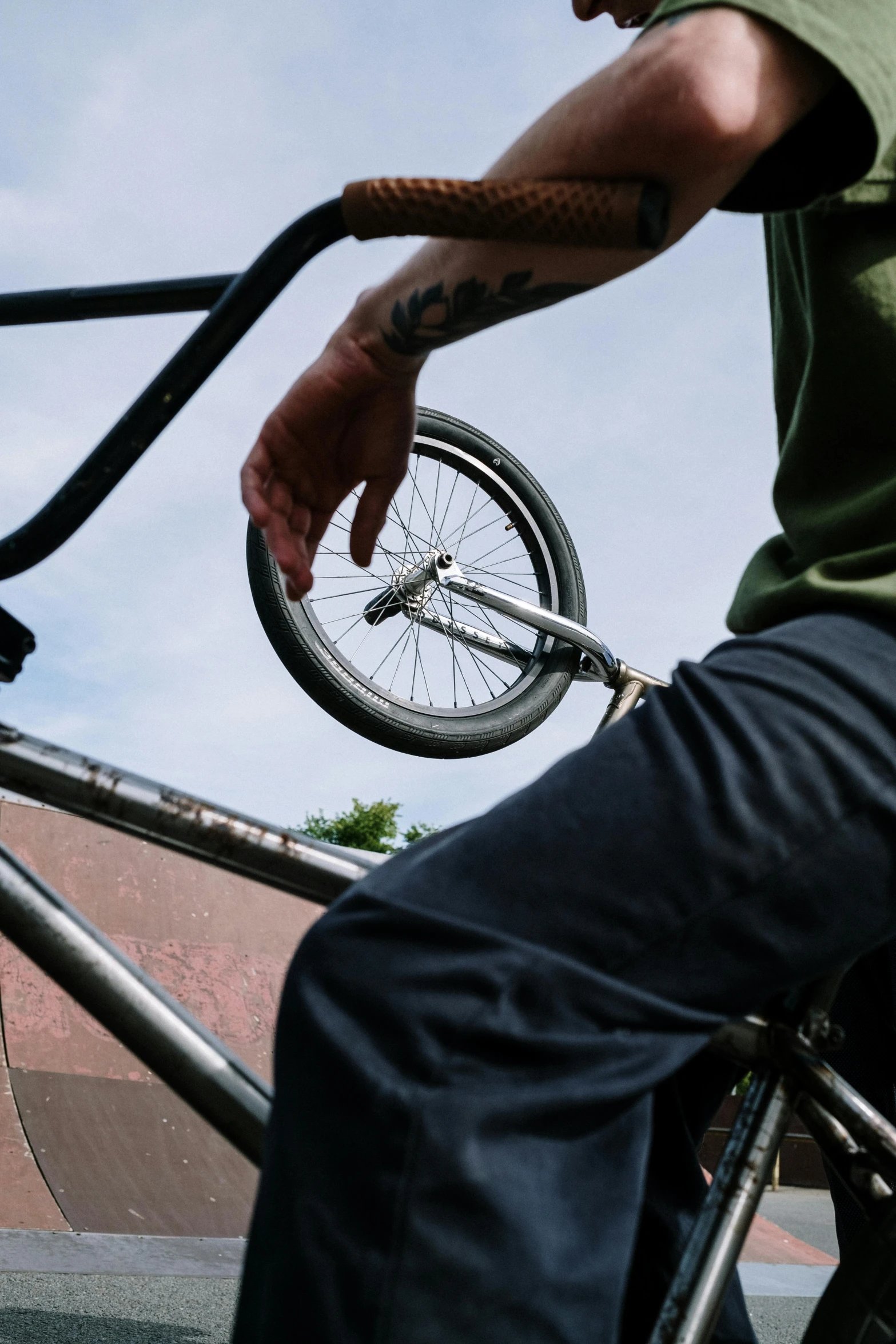 a man riding a bike up the side of a ramp, a picture, by Sven Erixson, unsplash, close up high detailed, whip in hand, mechanic, no cropping