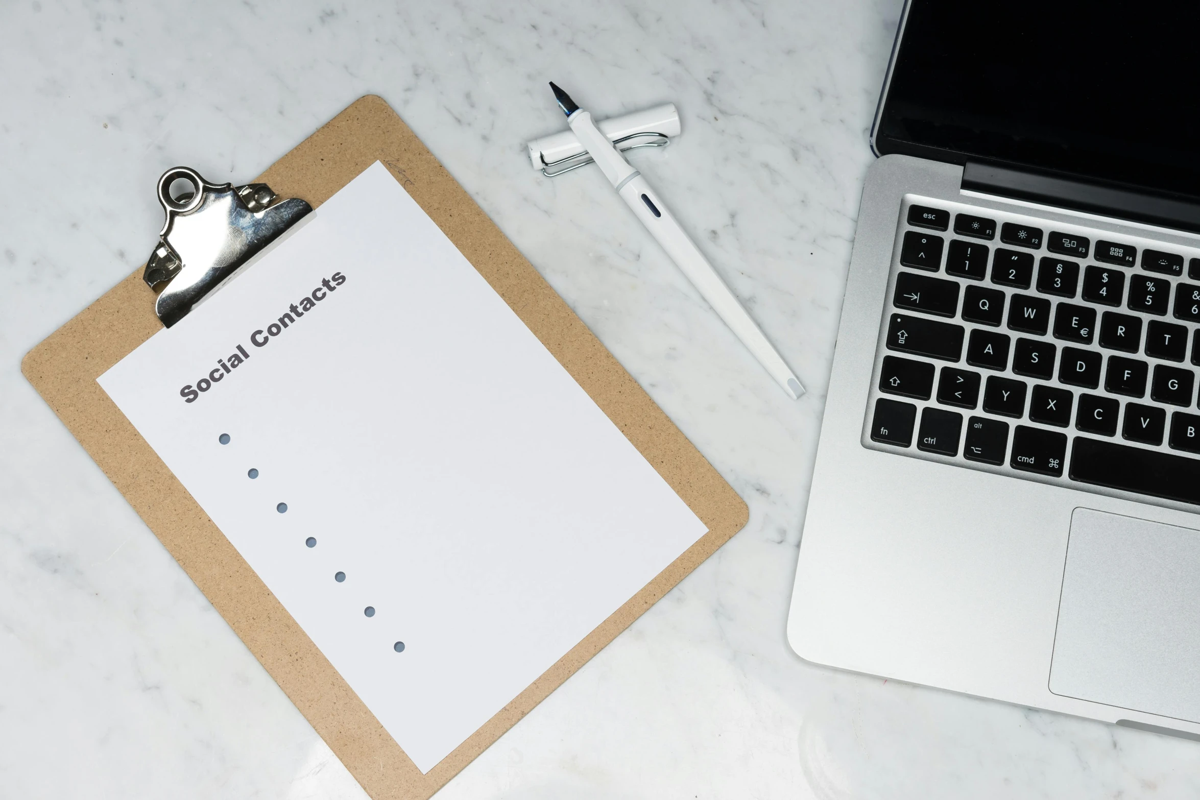 a laptop computer sitting on top of a desk next to a clipboard, by Julia Pishtar, pexels contest winner, minimalism, black ball pen on white paper, tactile buttons and lights, thumbnail, social media