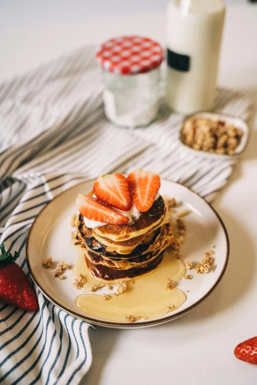 a stack of pancakes with strawberries on a plate, a portrait, by Julia Pishtar, pexels contest winner, seeds, milk, listing image, full product shot