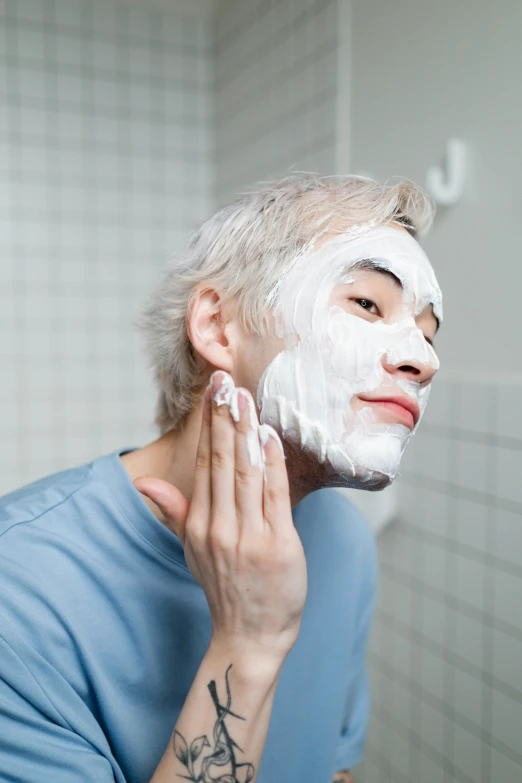 a man shaving his face in the bathroom, by Jang Seung-eop, face mask, white-hair pretty face, profile image, square facial structure
