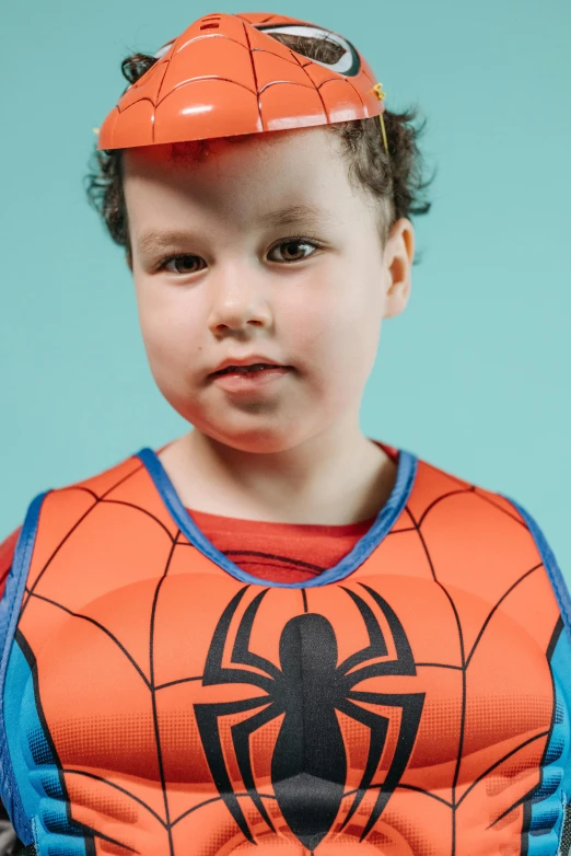 a young child wearing a spider - man costume, by artist, body armour, blippi, upper body close up, concern