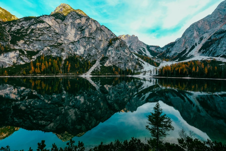 a lake with mountains in the background, pexels contest winner, mirrored, ornately detailed, teal landscape, comfortable
