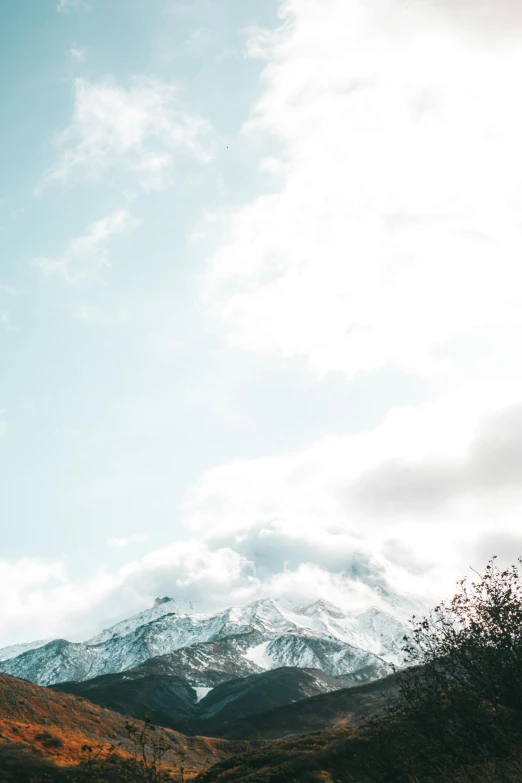 a man flying through the air while riding a snowboard, trending on unsplash, visual art, mount fuji, cloud-like white hair, background image, solo hiking in mountains trees