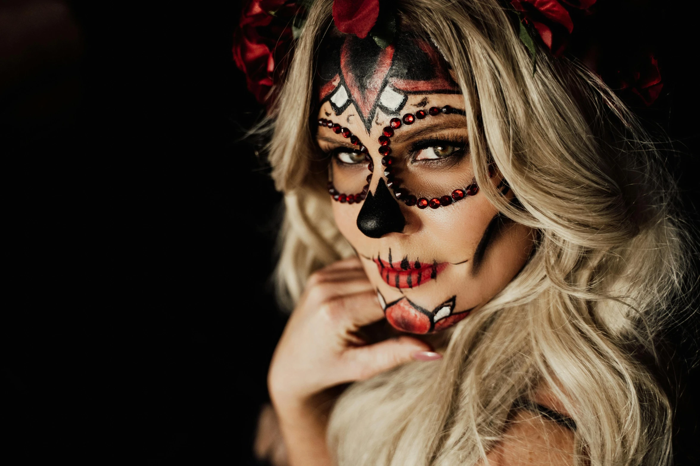 a woman with a skull make up posing for a picture, a photo, by Emma Andijewska, trending on pexels, beautiful tan mexican woman, red and black colour scheme, portrait of maci holloway, fancy dress
