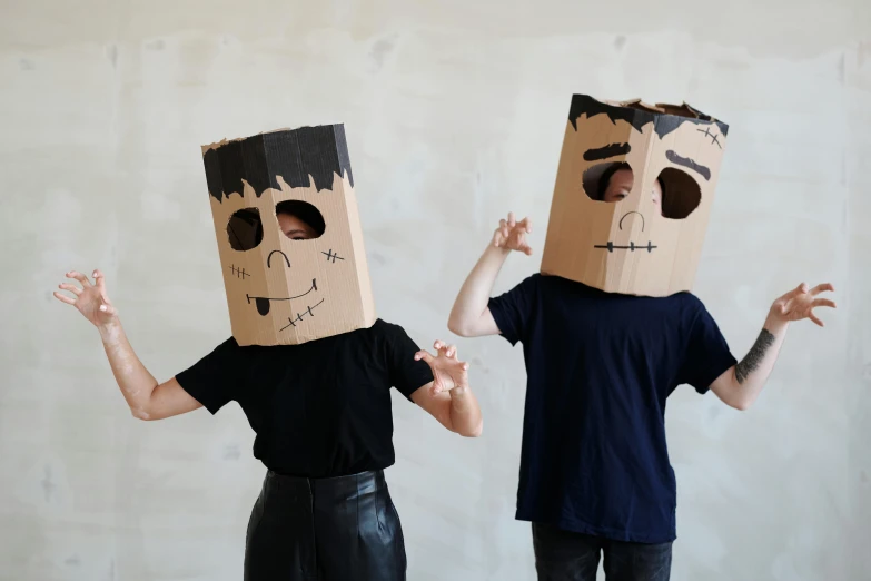 a couple of people with paper bags on their heads, pexels contest winner, conceptual art, black eyed kids, robot made of a cardboard box, avatar image, square face