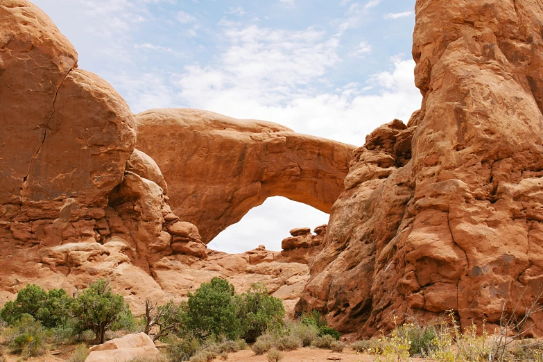 a large rock formation in the middle of a desert, by Pamela Ascherson, unsplash contest winner, white stone arches, wide windows, 2000s photo, 🦩🪐🐞👩🏻🦳