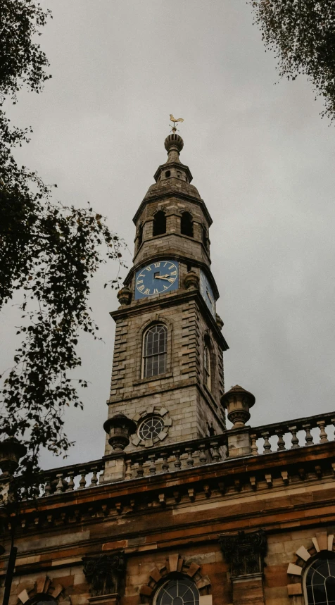 a tall tower with a clock on top of it, inspired by Christopher Wren, baroque, low quality photo, thumbnail