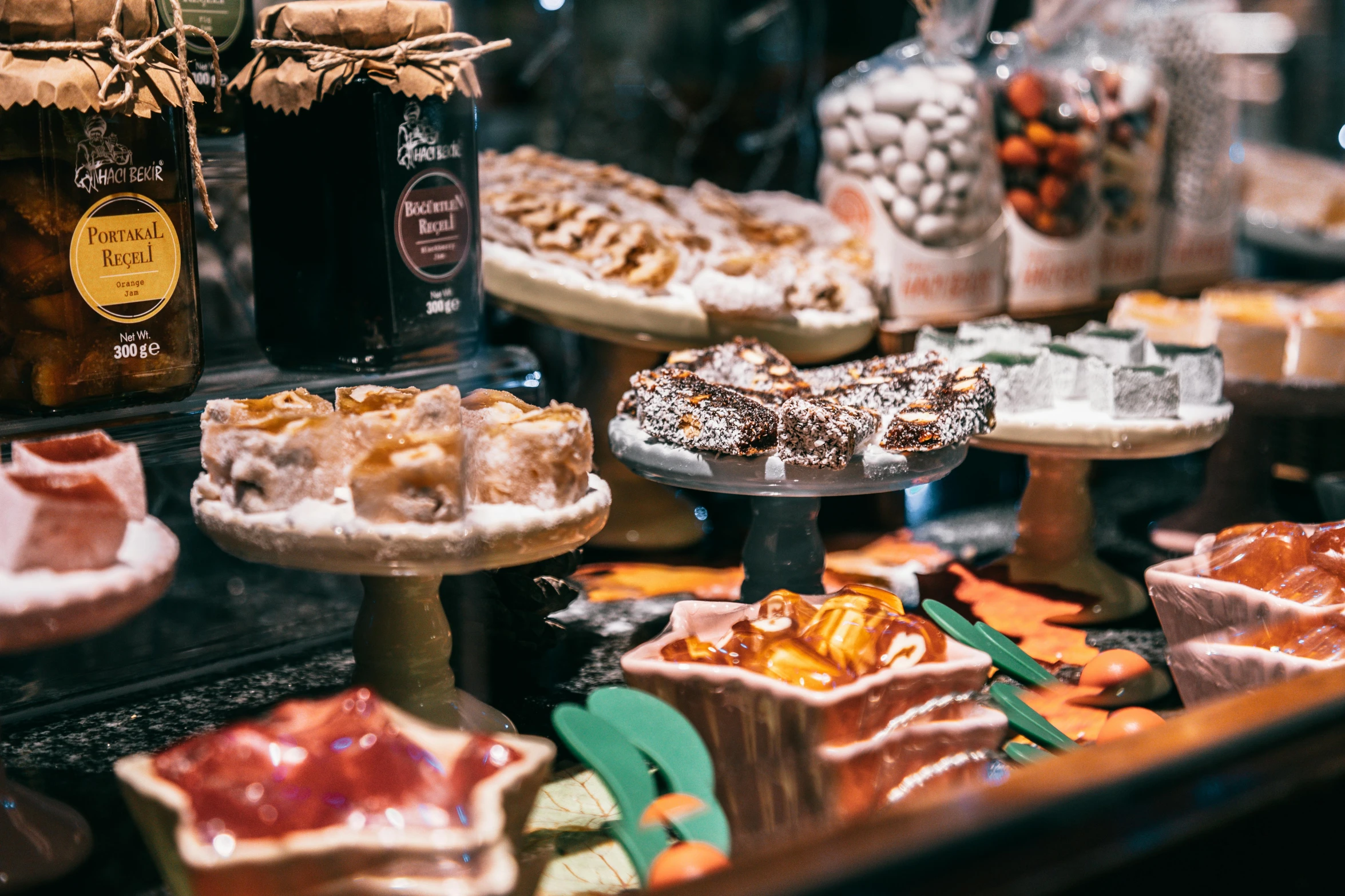 a display case filled with lots of different types of food, by Julia Pishtar, pexels contest winner, pastries, italian, 🎀 🧟 🍓 🧚, fall season