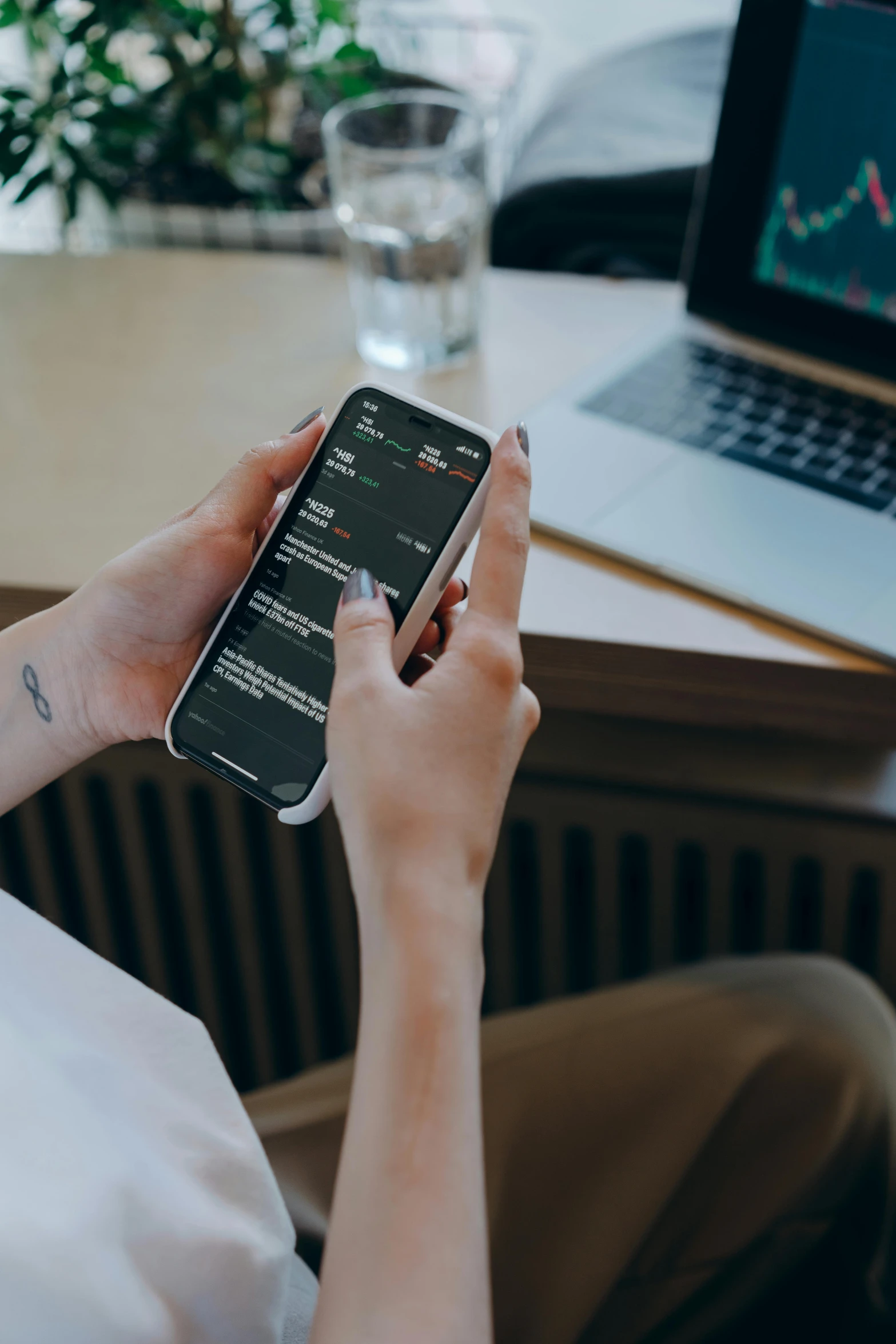 a person sitting in front of a laptop and a cell phone, trending on pexels, thumbnail, teaser, 8