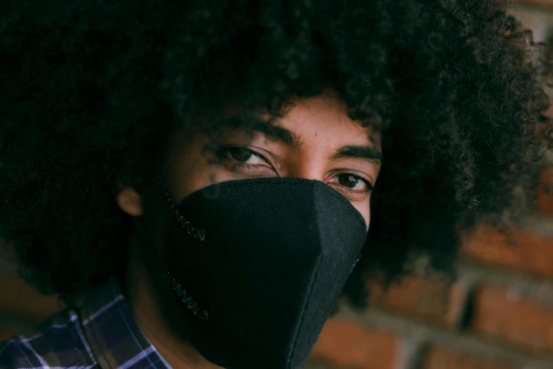 a close up of a person wearing a face mask, pexels contest winner, afrofuturism, black man with afro hair, wearing bandit mask, environmental, ashteroth