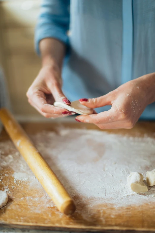 a close up of a person preparing food on a table, jen atkin, square, therookies, close-up photograph