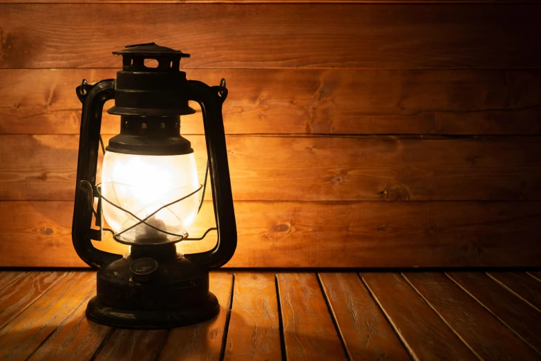 a lantern sitting on top of a wooden floor, shutterstock, holding electricity, old fashion, profile pic, museum lighting