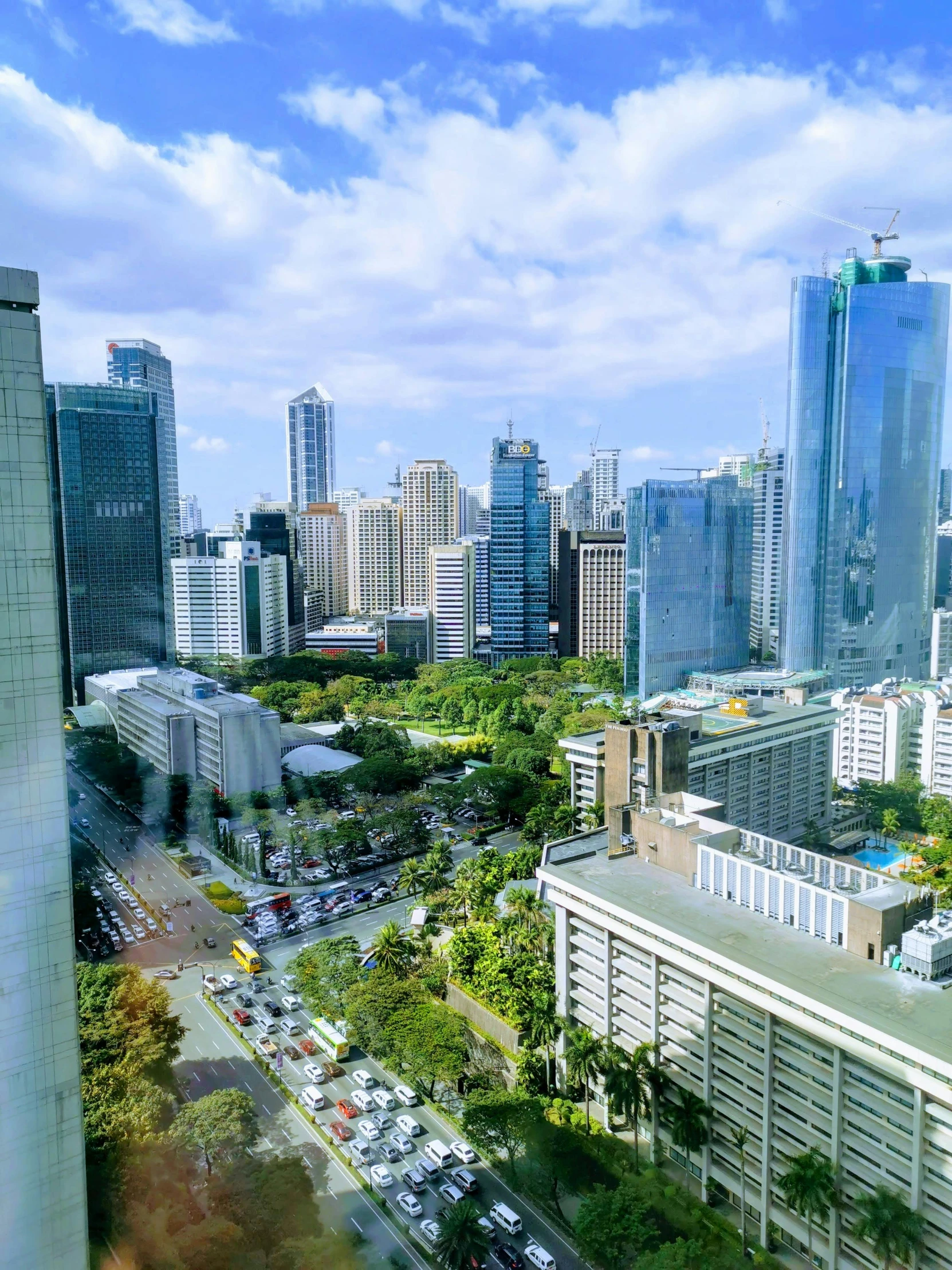 a view of a city from a high rise building, jollibee city, skyscrapers with greenery, gopro photo, square