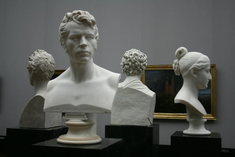 a group of busts on display in a museum, a marble sculpture, inspired by Mihály Munkácsy, simon birch, ary scheffer, nicolas bouvier, handsome man