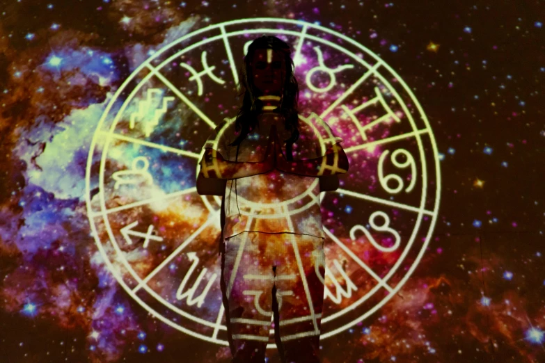 a man that is standing in front of a clock, a digital rendering, pexels, psychedelic art, zodiac libra sign, with glowing runes on the body, sza, taken through a telescope