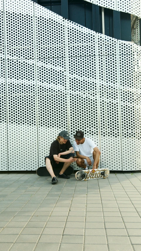 a couple of people that are sitting on a skateboard, by Dave Allsop, perforated metal, talking, instagram photo, programming